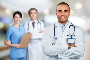 Happy cheerful male doctor with stethoscope