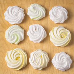 Homemade sweet colored meringue on wooden background.  .Dessert. Top view.
