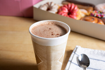 A view of a hot chocolate drink, in a still life setting.
