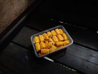 Jam cookies filled with black wood background