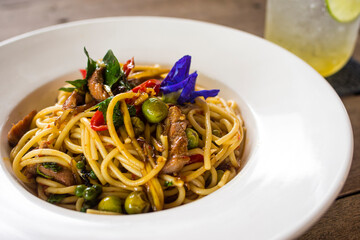 Spicy stir-fried spaghetti in Thai style, served with a buffet in a Thai BBQ restaurant. Spicy food