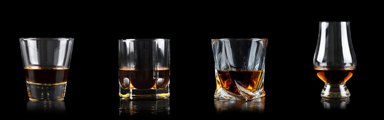Set of four glass of whiskey on black background