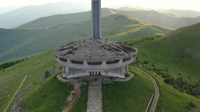 Buzludja. Dron top view on one of the largest in Europe abandoned communist monuments in the Balkan mountains, Bulgaria. UFO disc-shaped building with a red star.
