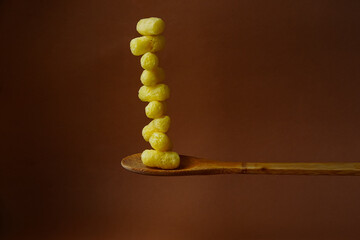 corn sticks in a wooden spoon