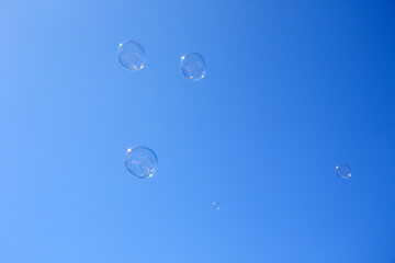 soap bubbles on blue sky