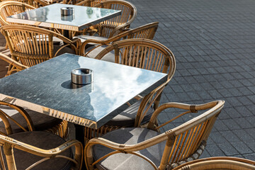 empty coffee terrace with tables and chairs in outdoor cafe