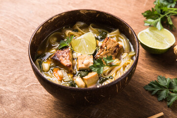Miso Ramen Asian noodles soup with tempeh or tempe  in a bowl. Health food for healthy eating for vegans & vegetarians. A close-up view of Chinese noodle soup