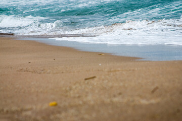 Fototapeta na wymiar wave on the beach and sand