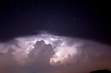 Naklejka na ściany i meble Dramatic cloudy sky with thunder storm and lighting
