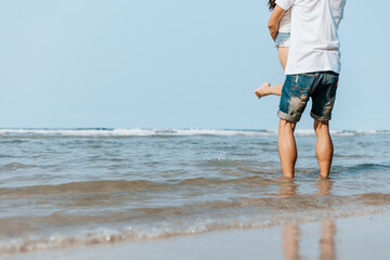 Romantic couple having love and hug on the beach.