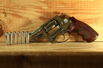 Revolver .38 mm.The gun is made of stainless steel and wooden handle. The projectile was placed.