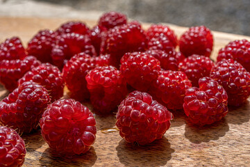 Raspberry close up macro on a wood background. Nature background. Fresh fruit. High quality photo