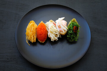 Fried tofu stuffed with rice and various topping such as fish roe, wakame, egg