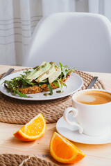 breakfast on a wooden kitchen table.
