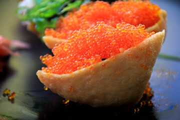 Fried tofu stuffed with rice and various topping such as fish roe, wakame, egg