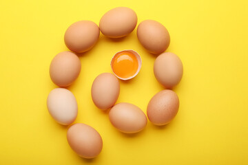 Fresh chicken eggs on color background