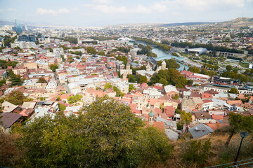 Fototapeta premium Tbilisi, Georgia - October 21, 2019: Top view on the old part of the city Tbilisi in Georgia in a day