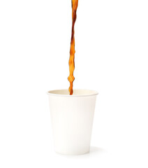 Pouring of hot coffee in cup on white background