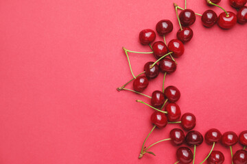 Ripe sweet cherry on color background