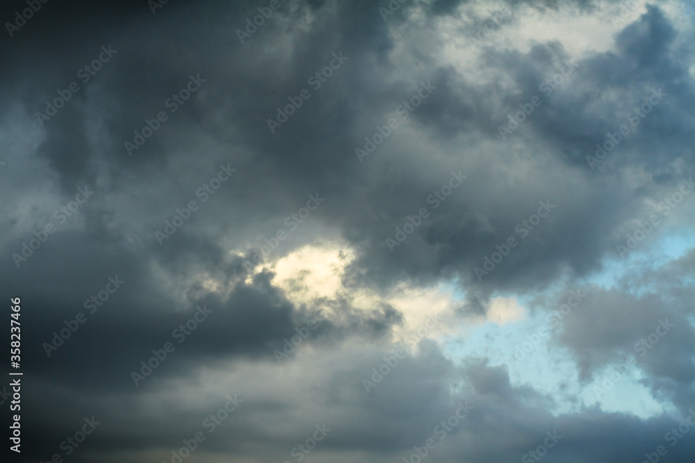 Wall mural picturesque clouds in the sky. window view of an airplane on a sunny gloomy day. stock photo backgro