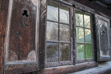 Frozen windows on an old Norwegian wooden house