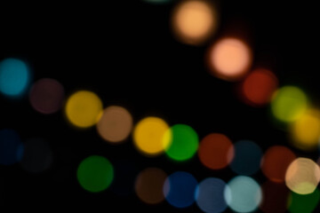 Colorful cicle bokeh on dark background in the night time