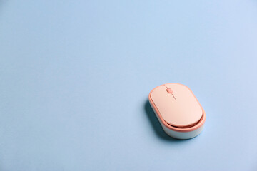 Modern computer mouse on color background