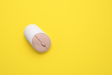 Modern computer mouse on color background