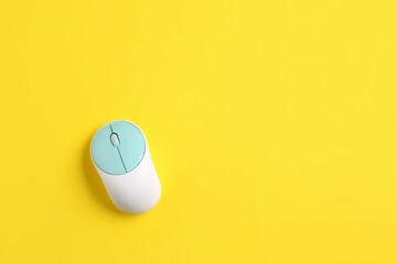 Modern computer mouse on color background