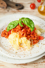 Tasty pasta bolognese on plate, closeup
