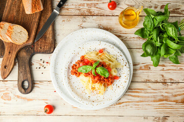 Plate with tasty pasta bolognese on table