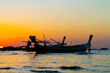 Obraz premium Traditional wooden boats on sunset, Koh Lanta, Thailand