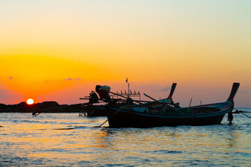 Traditional wooden boats on sunset, Koh Lanta, Thailand