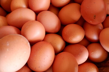 Close-up of fresh chicken eggs (telur ayam) in a basket