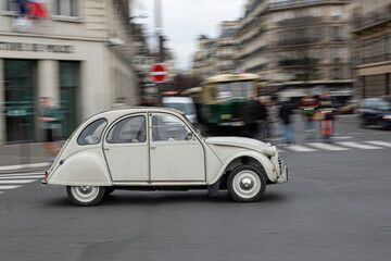 Fototapeta na wymiar Paris France; January 10, 2020: Nice Classic gray car in the street