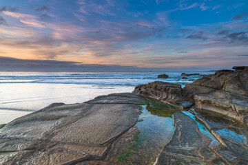 Sunrise Seascape with Clouds and Ships on the Horizon