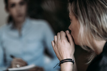 Female PTSD Patient Talking with Psychotherapist.