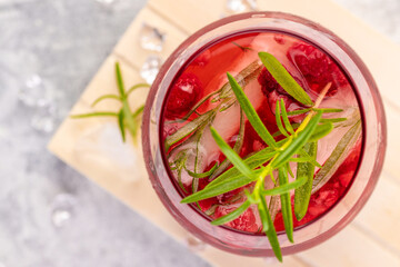 Summer refreshing cocktails made of rose wine or gin with raspberries and rosemary.