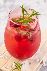 Summer refreshing cocktails made of rose wine or gin with raspberries and rosemary.