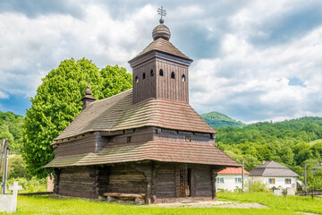 Fototapeta na wymiar View at the Wooden Church of Saint Michael Archangel in village Ulicske Krive, Slovakia