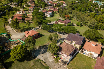 Aerial of beautiful houses in an exclusive subdivision in southern Manila. Upscale homes in...