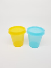 colorful plastic container over white background