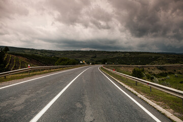 empty road between two fields in moldova. Asphalt road in moldova.