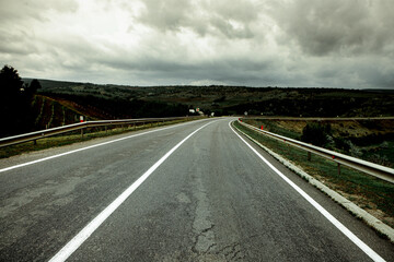 empty road between two fields in moldova. Asphalt road in moldova.