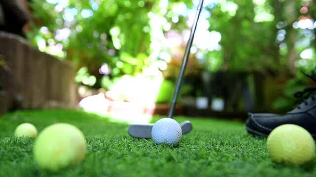 play golf in the garden. Sport and workout during work home. Social distancing and wellness lifestyle.