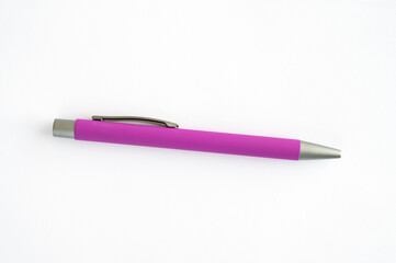Pink pen placed isolated on white surface