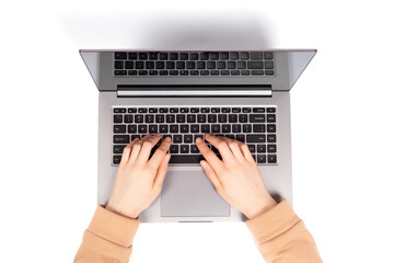 Female hands working on new laptop isolated on white background