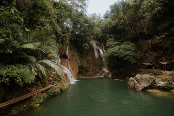 Fototapeta na wymiar nature stamp with a beautiful waterfall on the island of bohol in the philippines