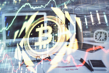 Double exposure of blockchain and crypto economy theme hologram and table with computer background. Concept of bitcoin cryptocurrency.