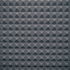 Fototapeta premium Soundproofing foam rubber texture with convex triangles in studio